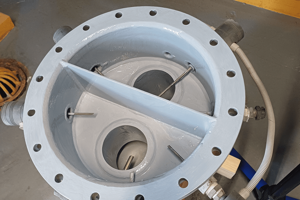 Industrial equipment with pipes and circular openings.