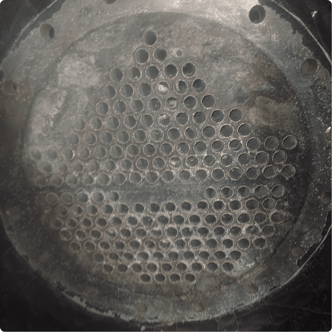 Metal plate with multiple circular holes.