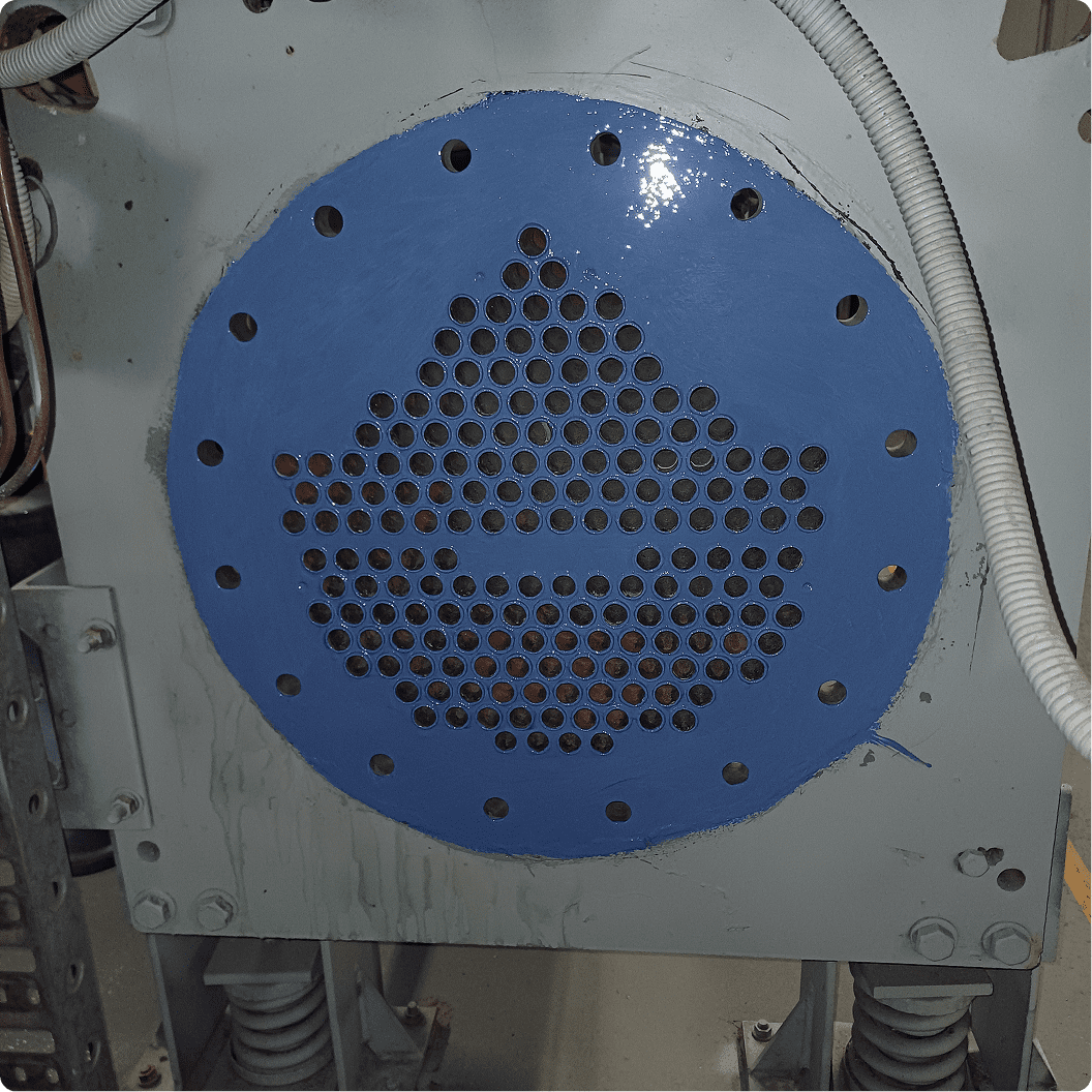 Blue industrial machinery component with perforated design.