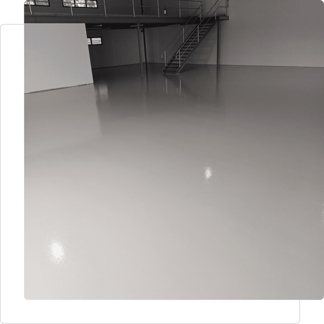 Empty room with shiny, polished concrete floor.
