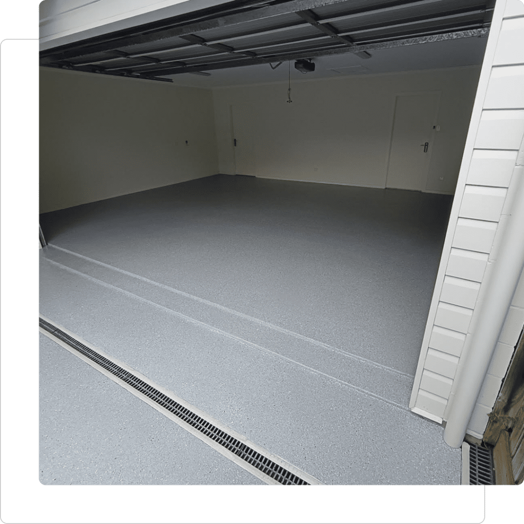 Empty garage with open door and floor.